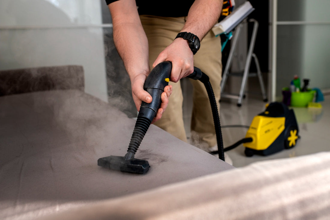 Man using a steam machine cleaner for cleaning service