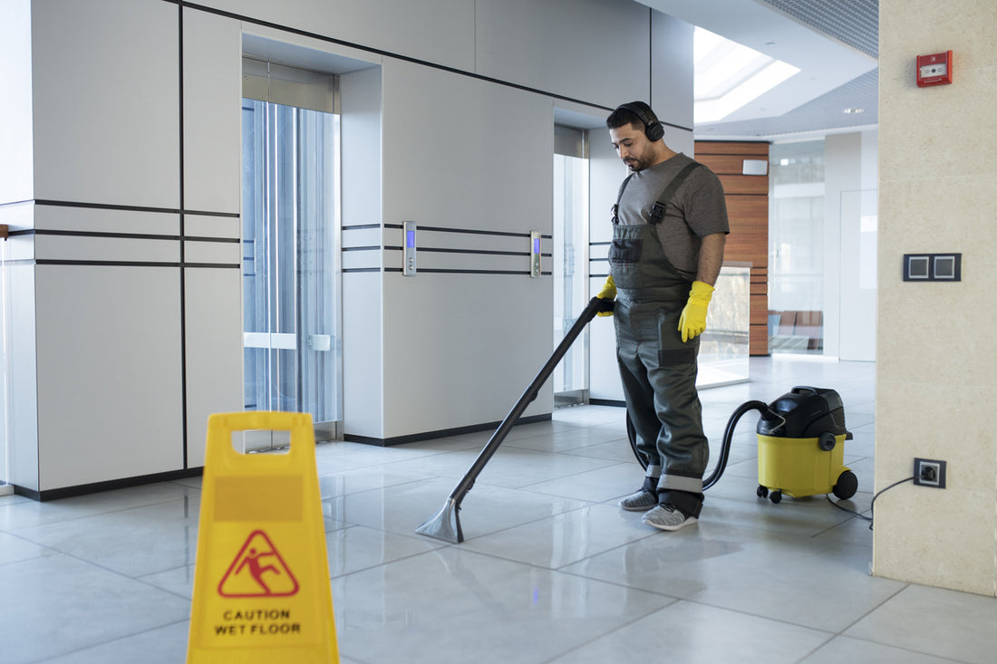 Cleaning employee happily working with high-quality equipment
